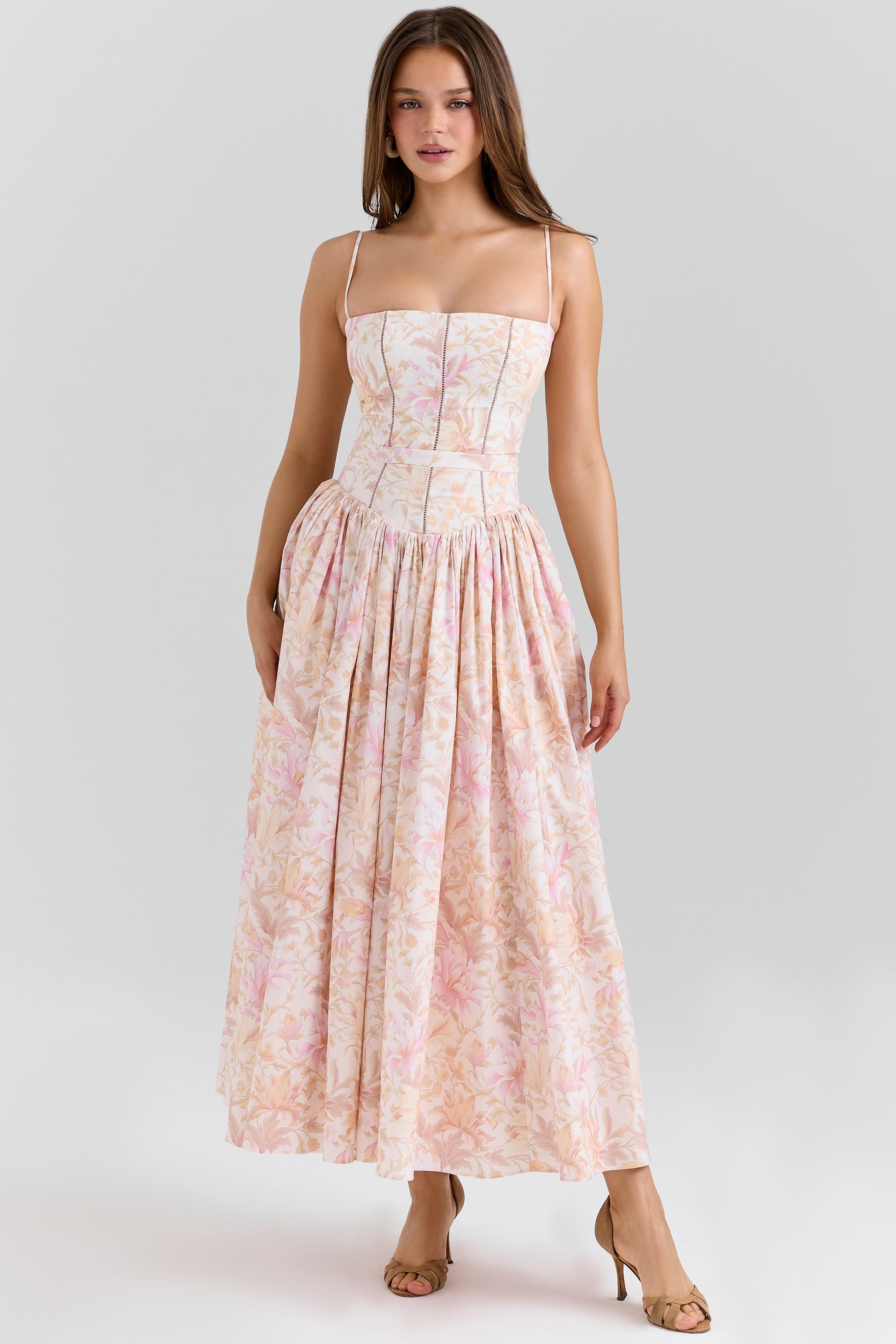 Front view of the Adeline Corset Midi Dress in a vibrant pink and orange floral print, with a fitted corset and full skirt.
