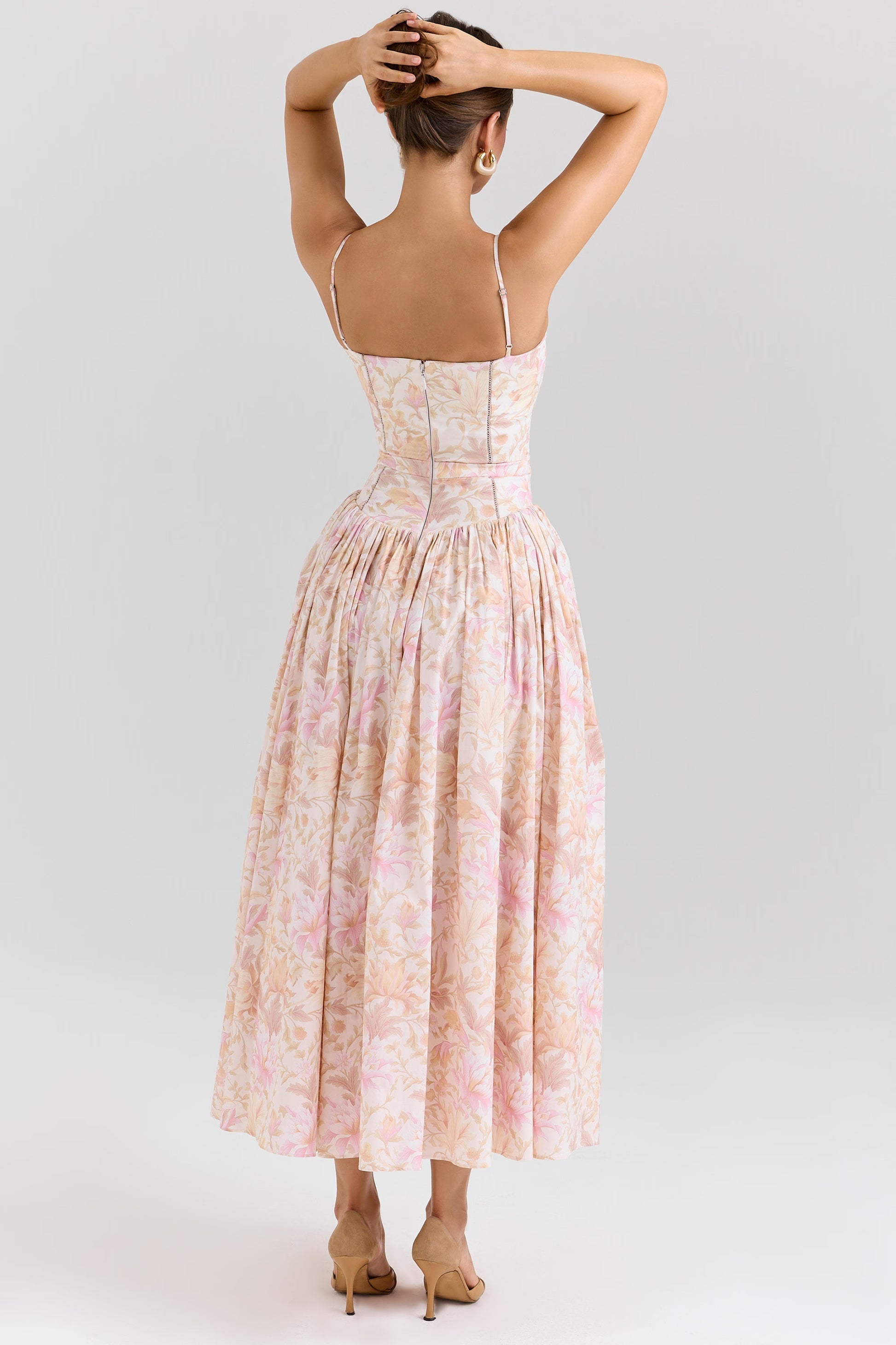 Back view of the pink and orange floral Adeline Corset Midi Dress, showcasing the delicate straps and full skirt.