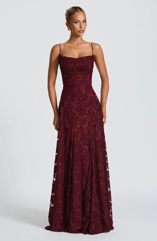 Full-length view of a deep burgundy floral maxi dress with spaghetti straps and a cinched waist.