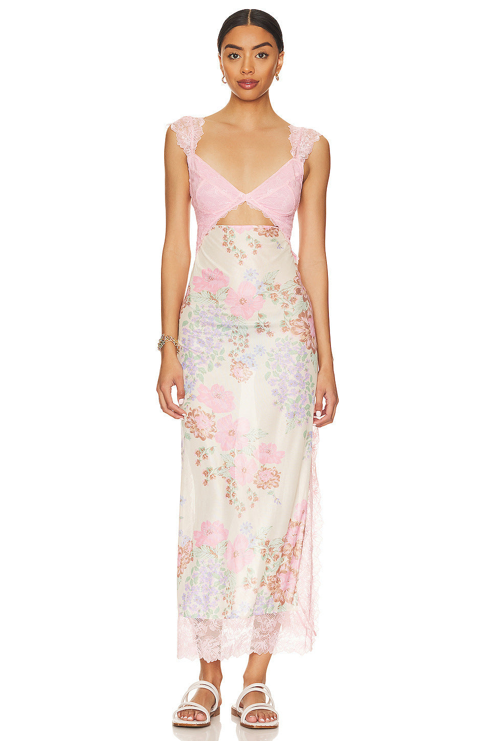 Front view of Aisha backless maxi dress in light pink with pastel floral print, lace bust, and cut-out detail.