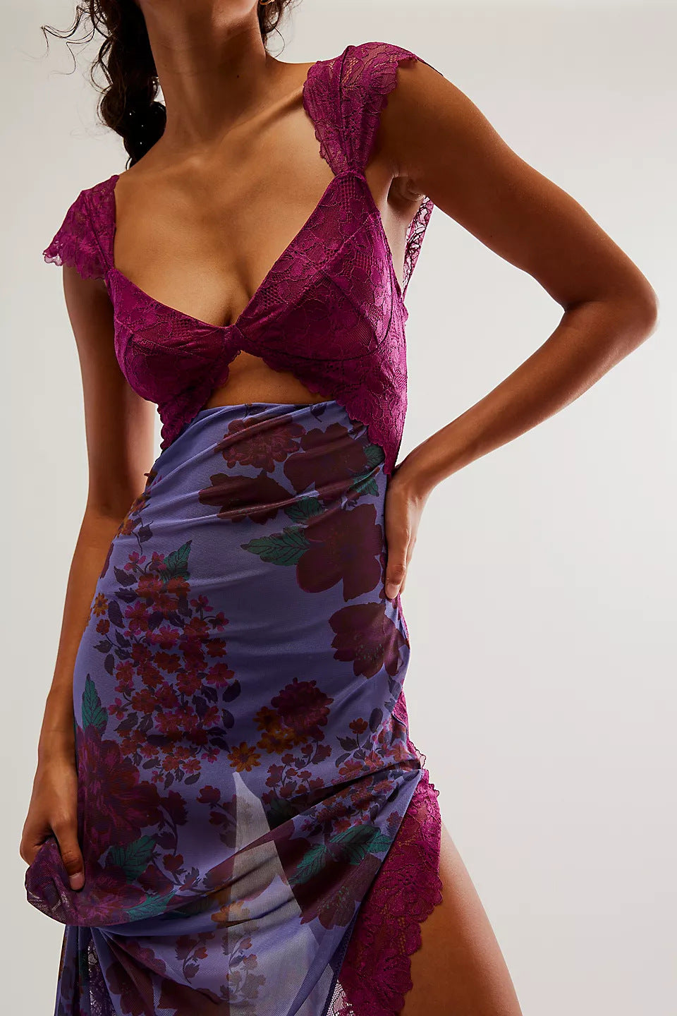 Close-up of the purple Aisha backless maxi dress with dark floral print, showing lace bust and cut-out detail.
