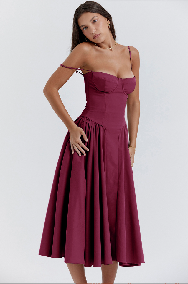 Front view of a deep burgundy corset midi dress with a sweetheart neckline and full skirt, one strap off the shoulder.