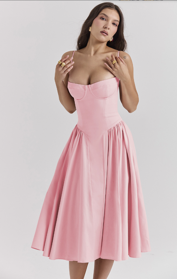 Pink Alexandra corset midi dress with a structured bodice, sweetheart neckline, and a wide, flowing pleated skirt.