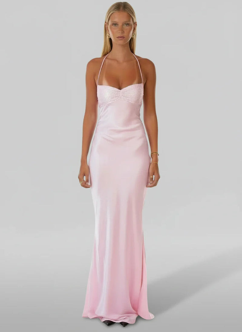 Full-length view of a light pink satin halter maxi dress with a beaded bust, perfect for formal occasions.