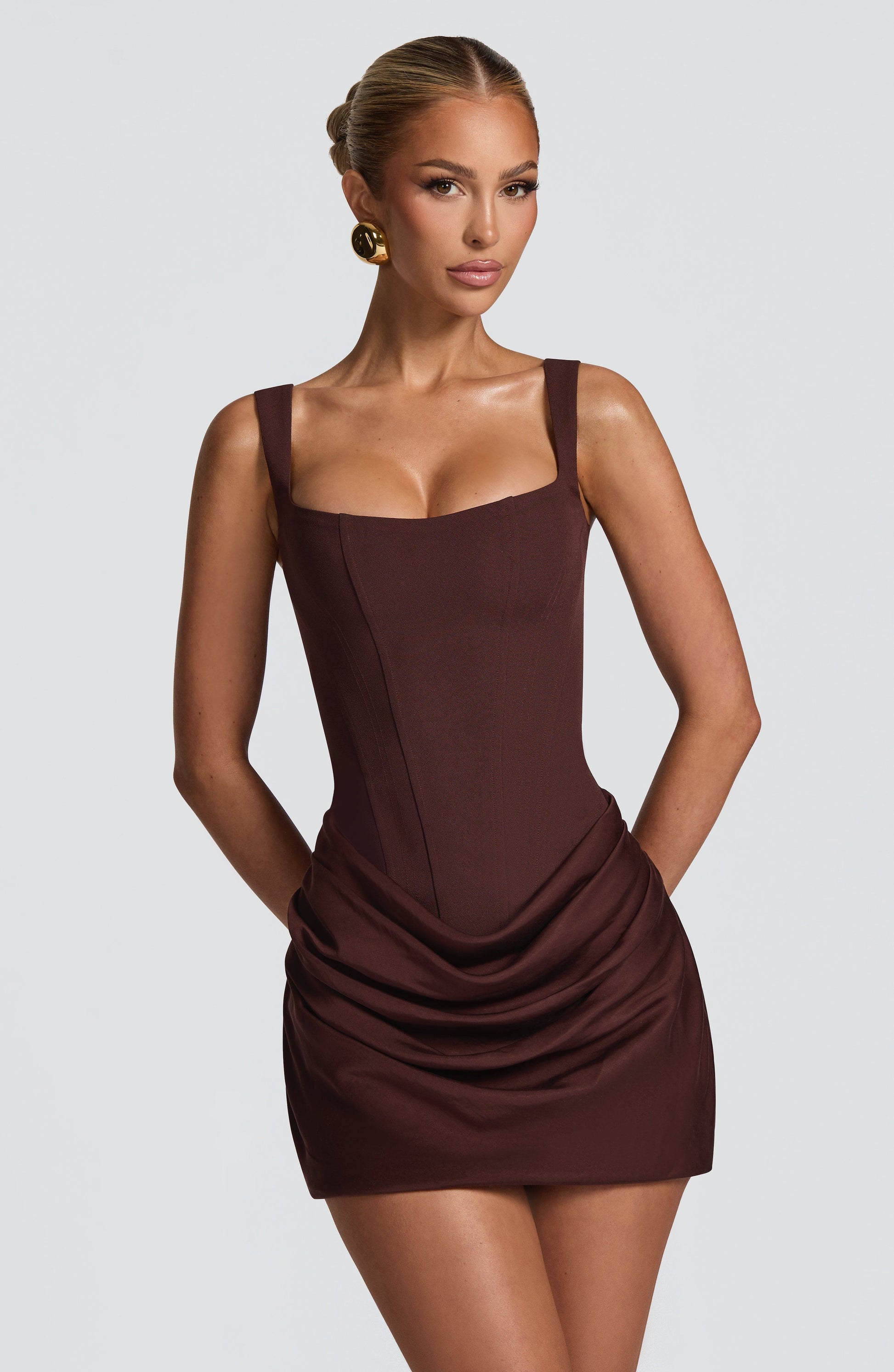 Close-up front view of the brown Amelie ruched mini dress, emphasizing the square neck and corset-style bodice.
