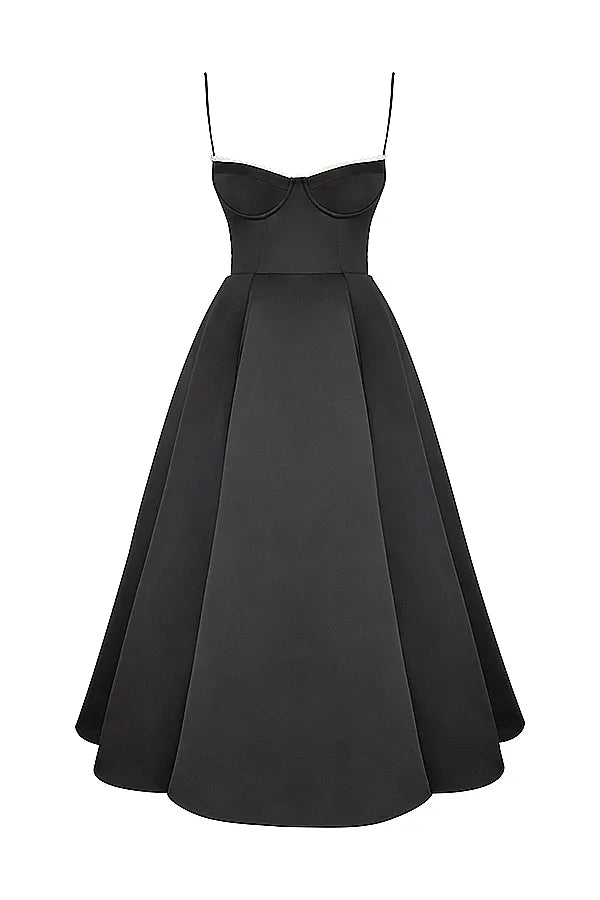 Studio shot of a black Angela corset midi dress with a structured bodice, sweetheart neckline, and a full, pleated skirt, on a white background.