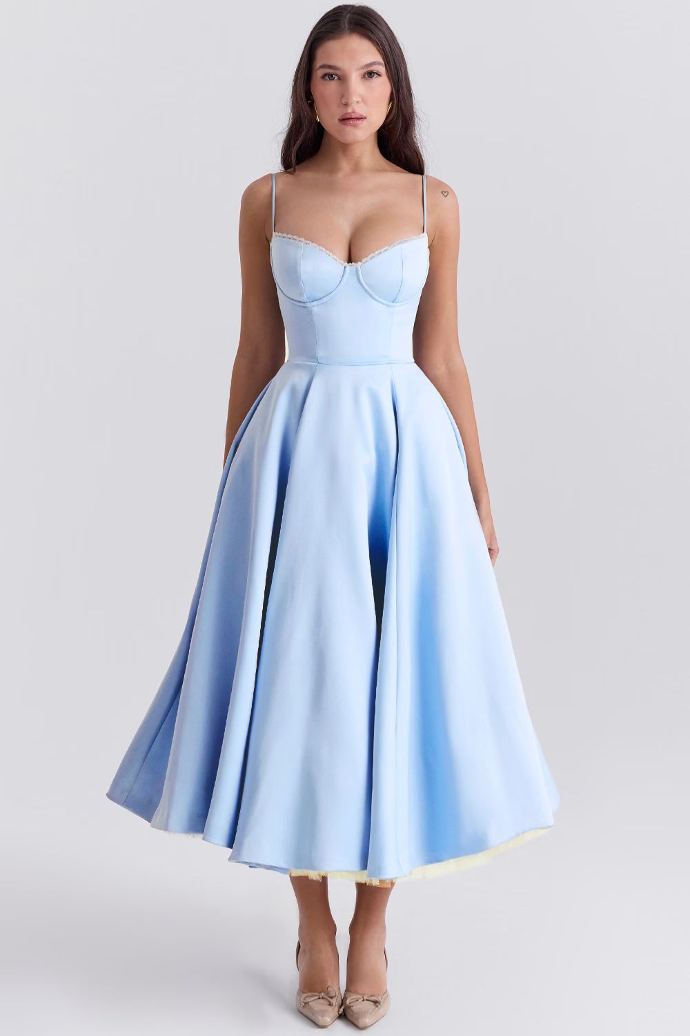 Front view of a light blue Angela Corset Midi Dress, showcasing a full skirt with a subtle yellow lining and white lace bust trim.