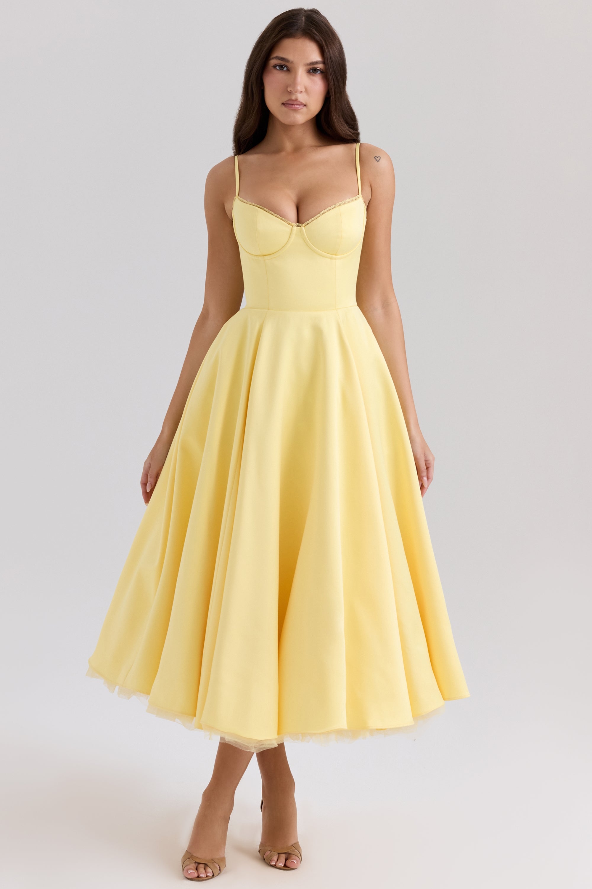 Front view of a vibrant yellow Angela Corset Midi Dress, featuring a full skirt and white lace trim on the bust, perfect for spring.