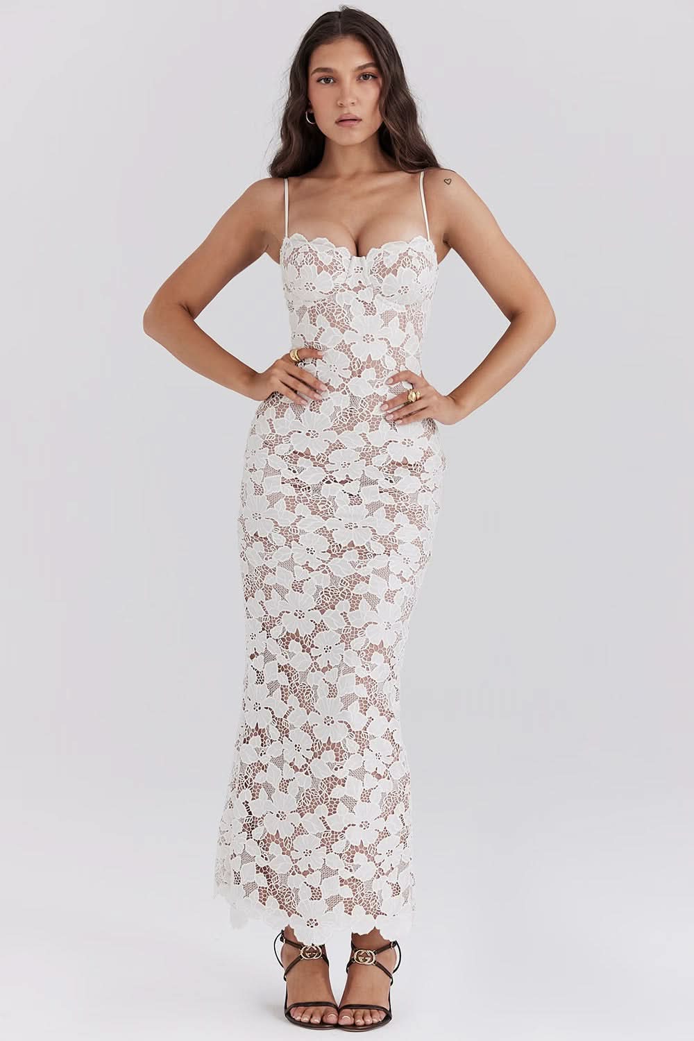 Front view of a white lace bodycon maxi dress with a sweetheart neckline and thin straps for women.