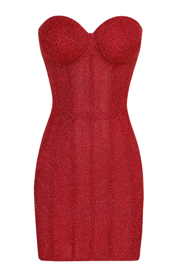 Strapless red glitter mini dress with a sweetheart neckline and structured bodice, held by a woman with dark hair.