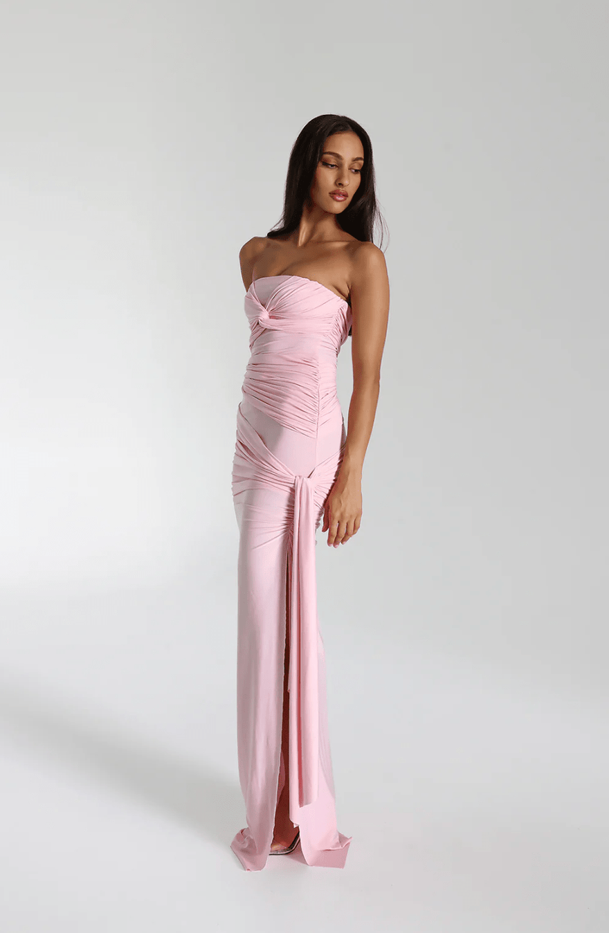 Side view of blush strapless ruched maxi dress, showing draped fabric detail and elegant fit for women