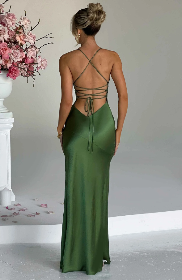 Back of an olive green Athena Plunge Maxi Dress, highlighting the elegant lace-up back detail and flowing skirt.