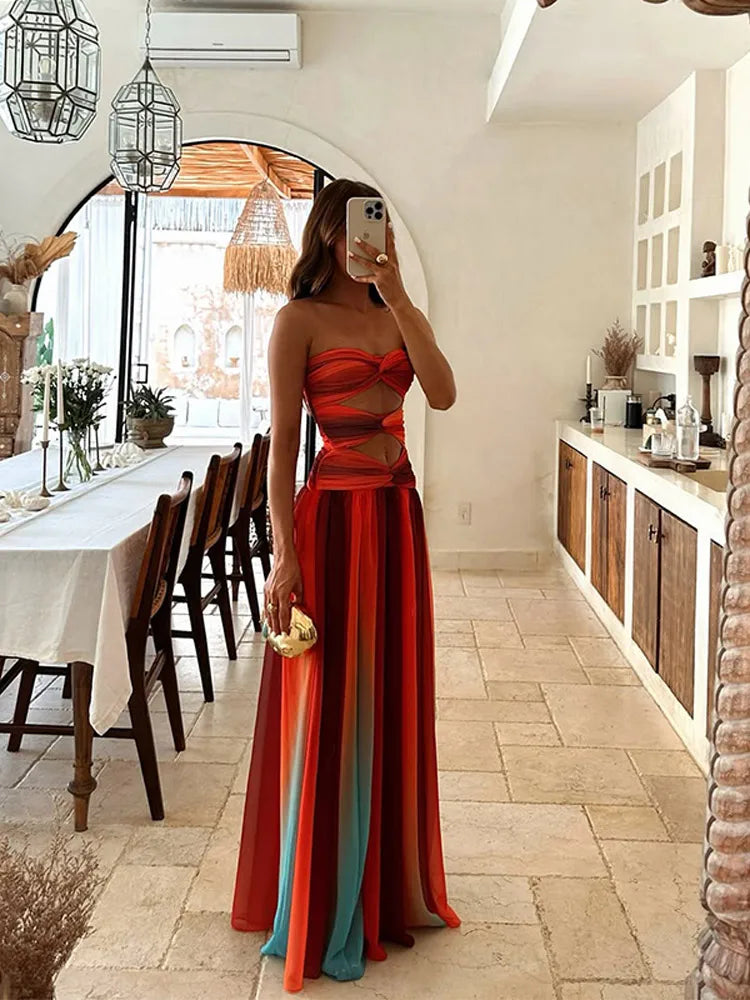 Side view of the Callie Cutout Maxi Dress in a striking ombre pattern, showcasing the strapless design and waist cutouts.
