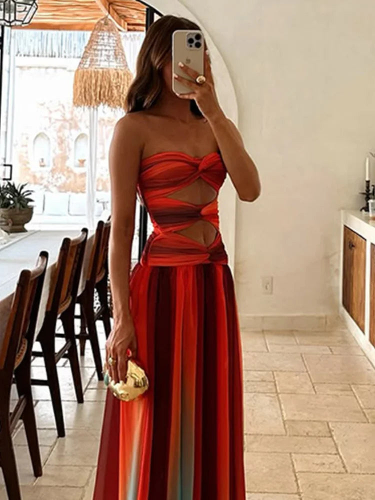 Close-up of the Callie Cutout Maxi Dress, highlighting the intricate twisted details on the bodice and the bold color blocks.