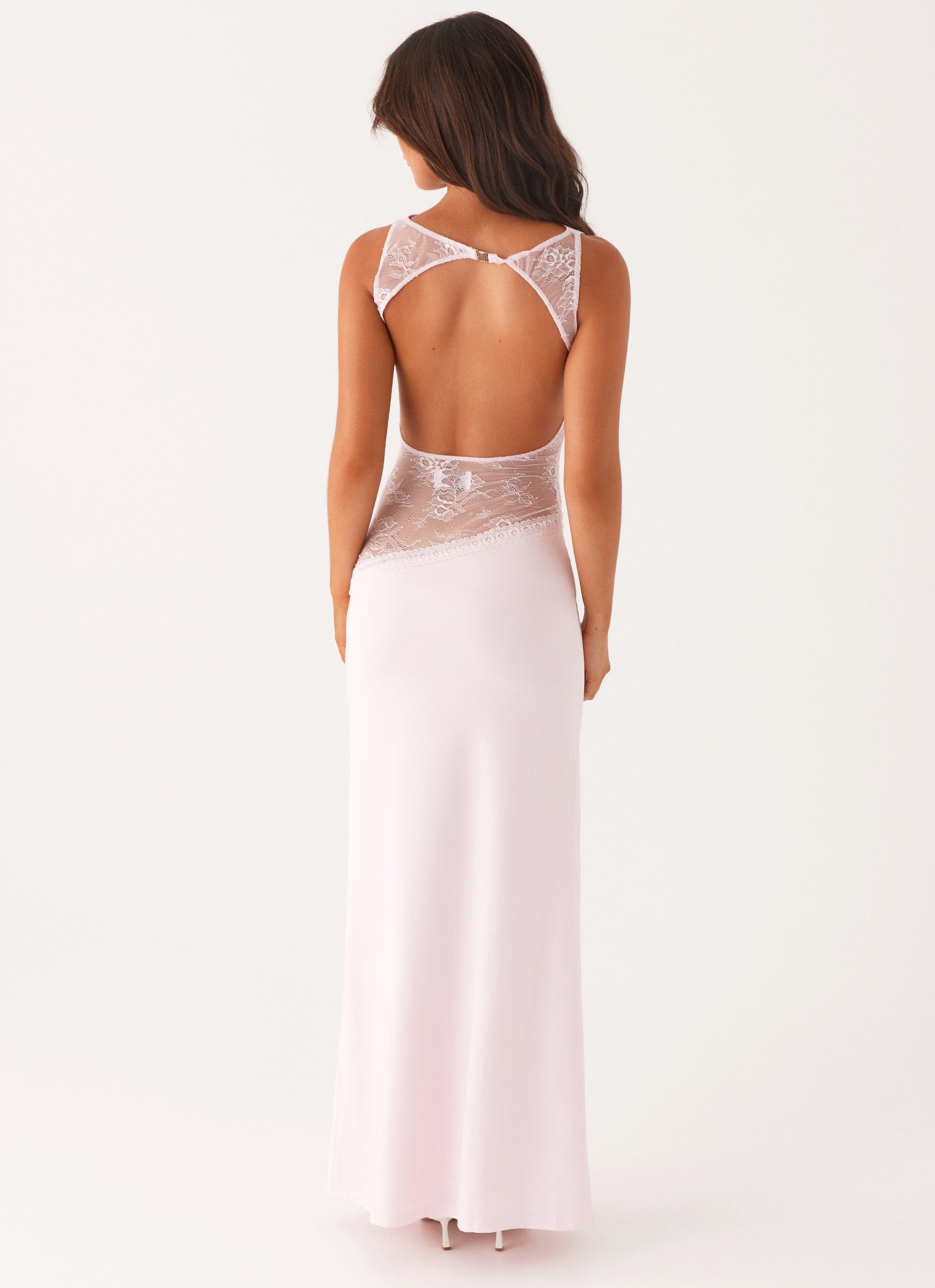 Back view of pale pink Camille Lace Maxi Dress, showcasing an open back with delicate lace details.
