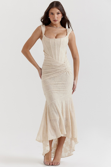 Elegant champagne floral jacquard corset maxi dress with a structured bodice and a draped, ruched skirt.