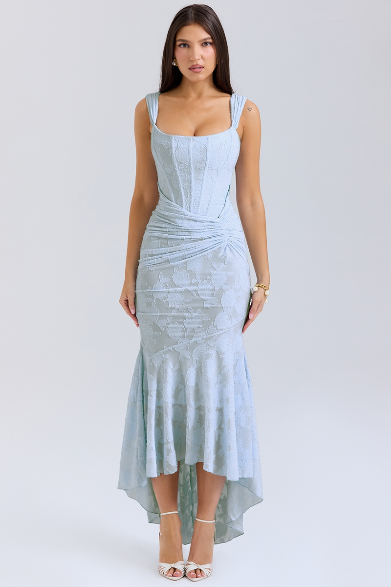 Light blue Carie corset maxi dress with floral jacquard fabric and ruched detail, high-low hem, and square neckline.