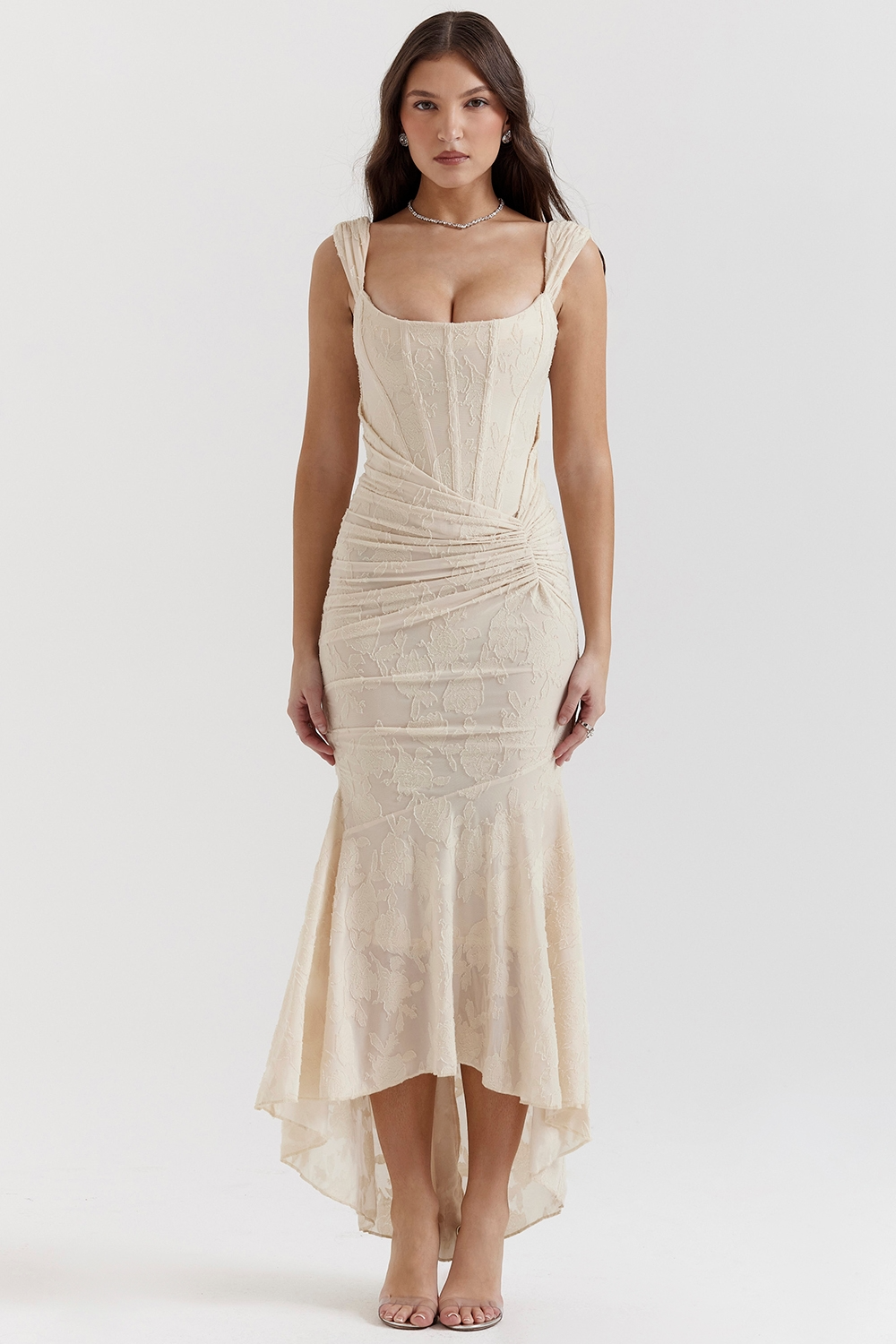 Front view of a champagne floral jacquard corset maxi dress with ruched details and a high-low hem, ideal for formal occasions.