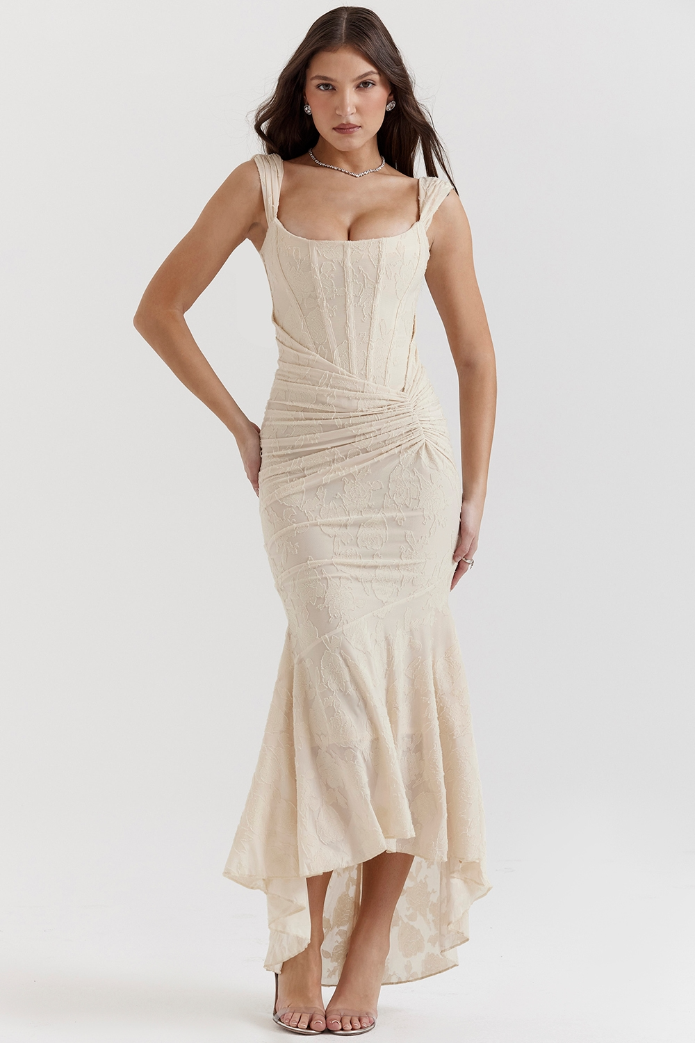 Elegant champagne floral jacquard corset maxi dress with a structured bodice and a draped, ruched skirt.
