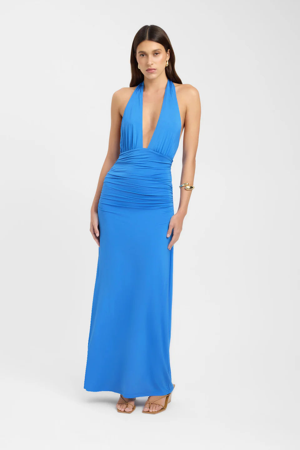 Vibrant blue ruched maxi dress with a halter neck and a flattering silhouette, ideal for a summer event.