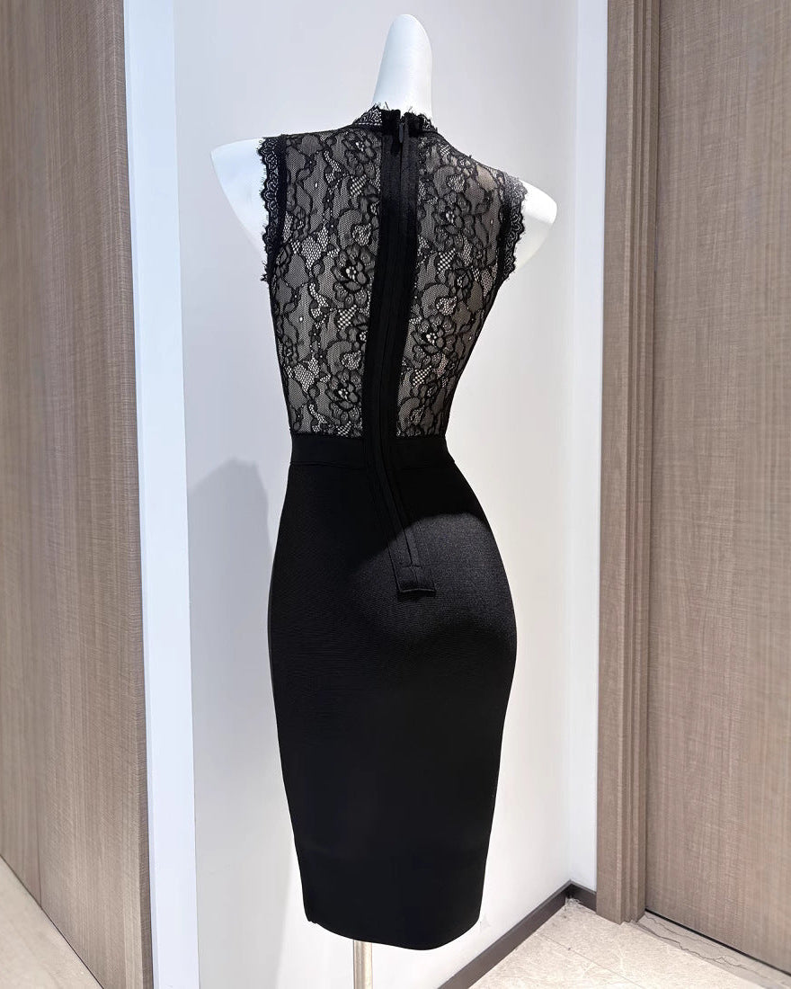 Back view of the black Cecily Lace Midi Dress on a mannequin, revealing the lace back and zipper closure.