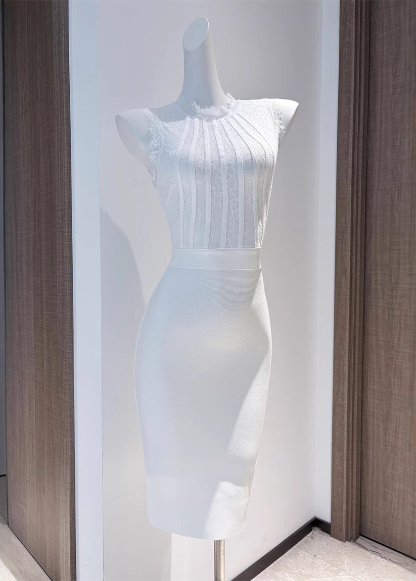 Mannequin displaying the Cecily Lace Midi Dress in a white color, with sheer lace top and solid skirt.