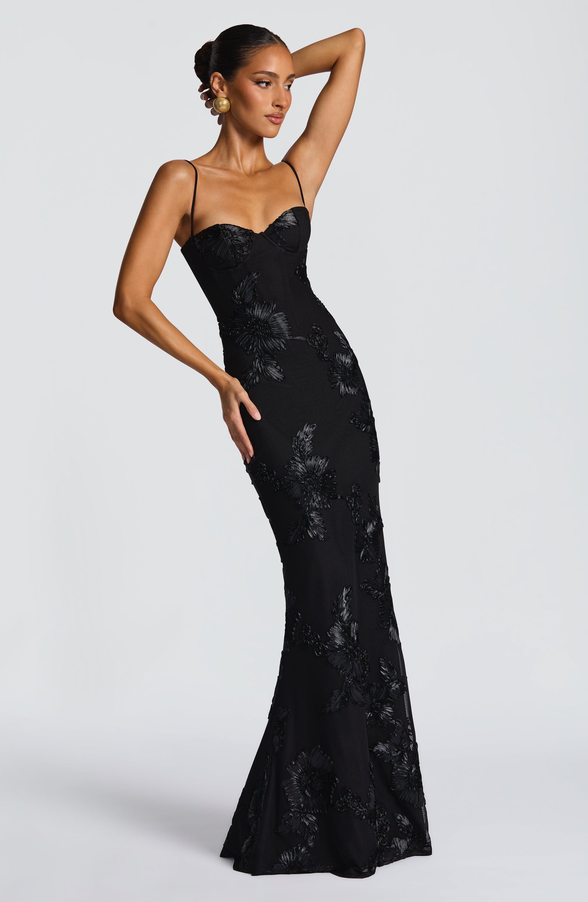Elegant black Celestina Floral Maxi Dress with delicate spaghetti straps and intricate floral appliques, perfect for ladies evening gowns.