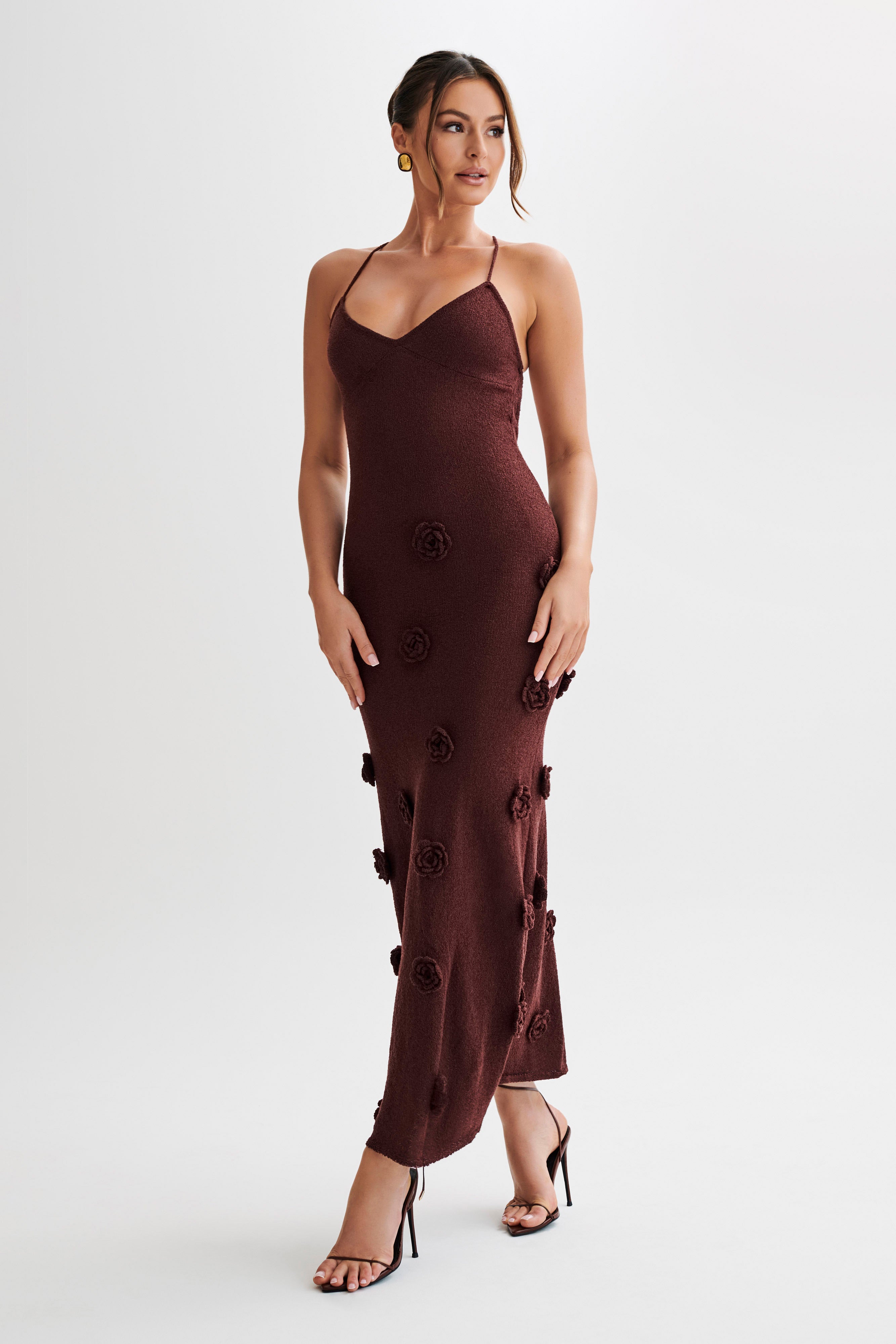 Front view of the dark brown Chelsea Floral Maxi Dress, showcasing the form-fitting design and unique floral texture.