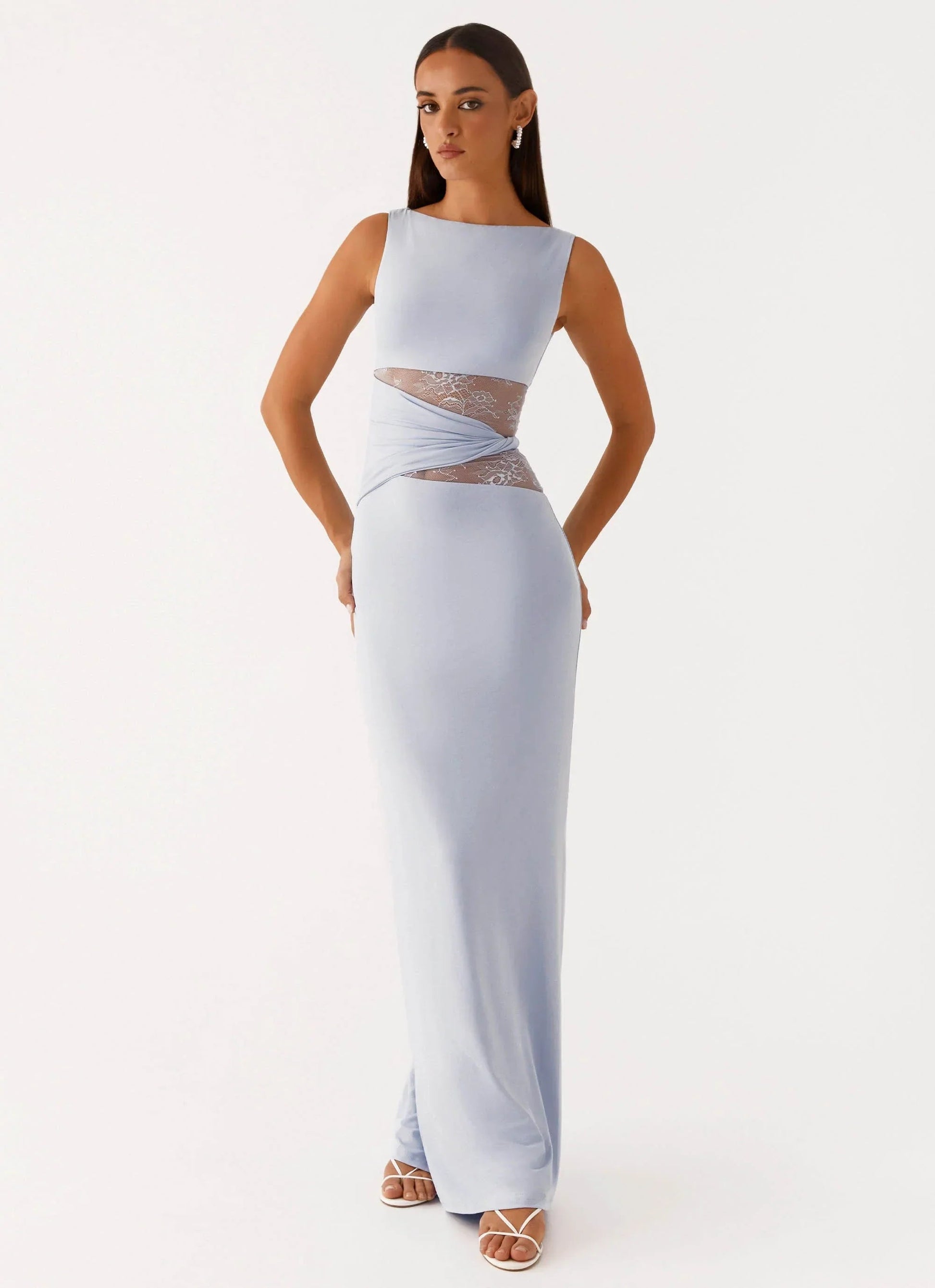 Light blue Clarisse maxi dress with sleeveless design and intricate lace detailing on the waist, front view.