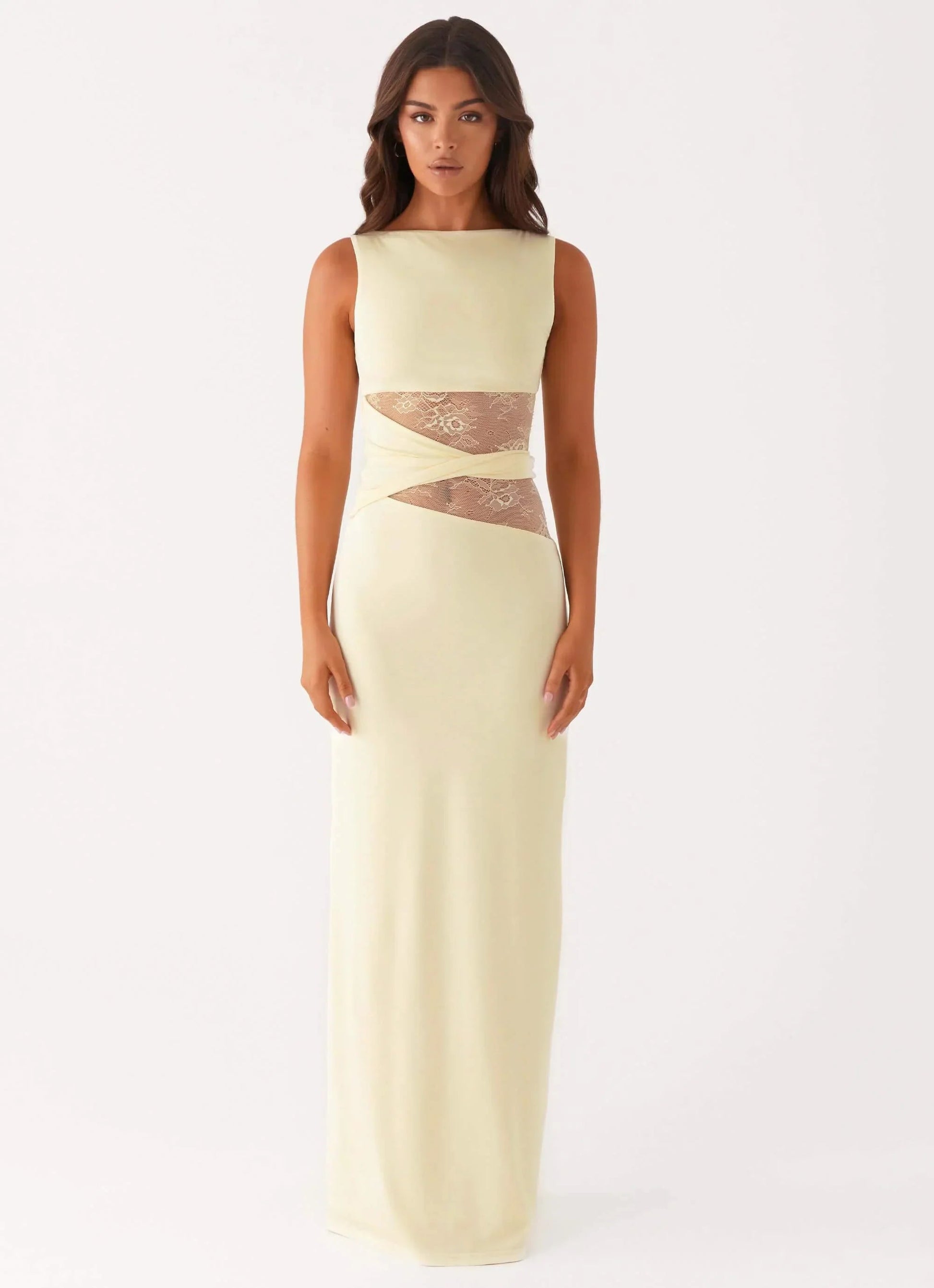 Pale yellow Clarisse maxi dress featuring a boat neck and elegant lace panels at the midriff, front view.