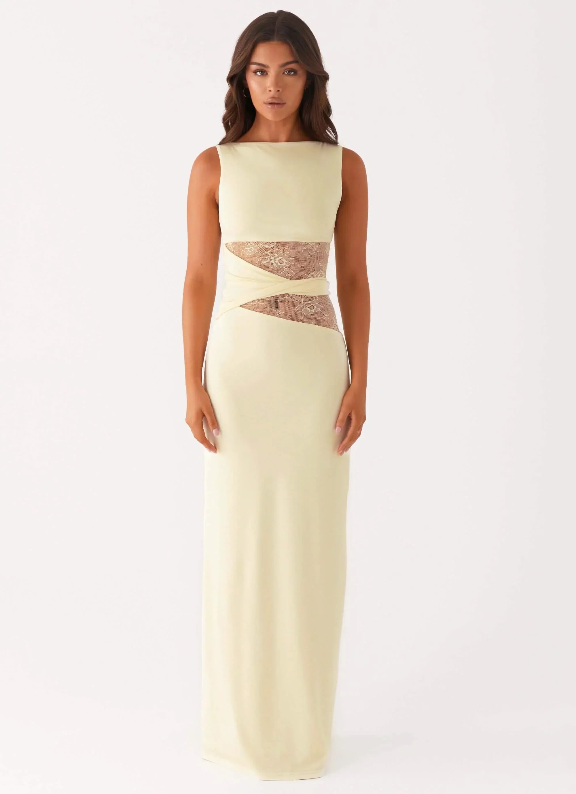 Pale yellow Clarisse maxi dress featuring a boat neck and elegant lace panels at the midriff, front view.