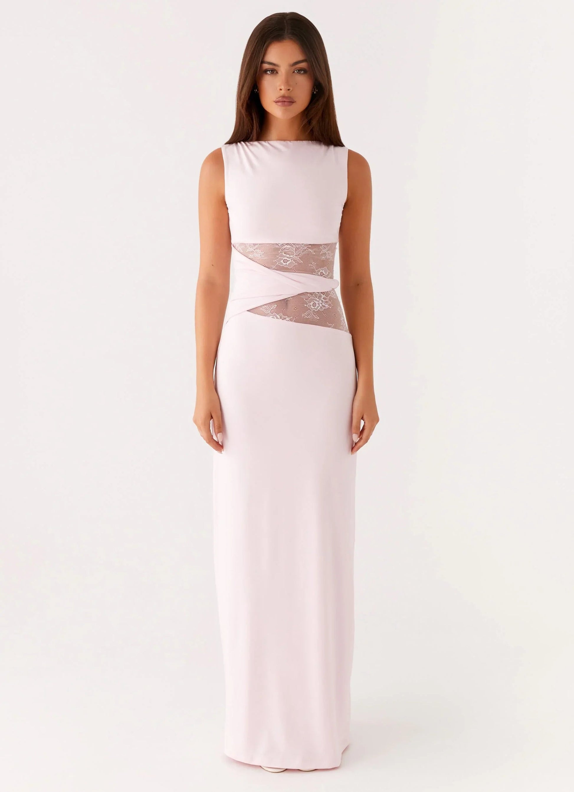 Blush pink Clarisse maxi dress with a sleeveless silhouette and delicate lace inserts creating a cinched waist effect.