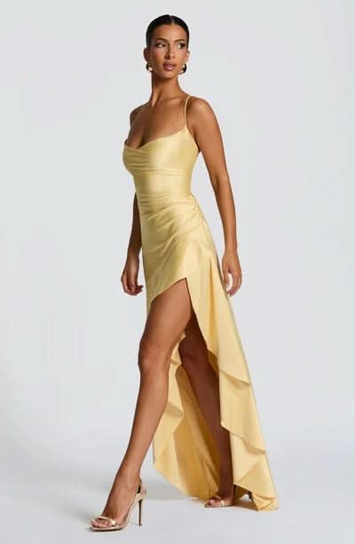 Elegant yellow Daisy Ruffle Maxi Dress with a sweetheart neckline, ruched bodice, and a high-low ruffled hem.