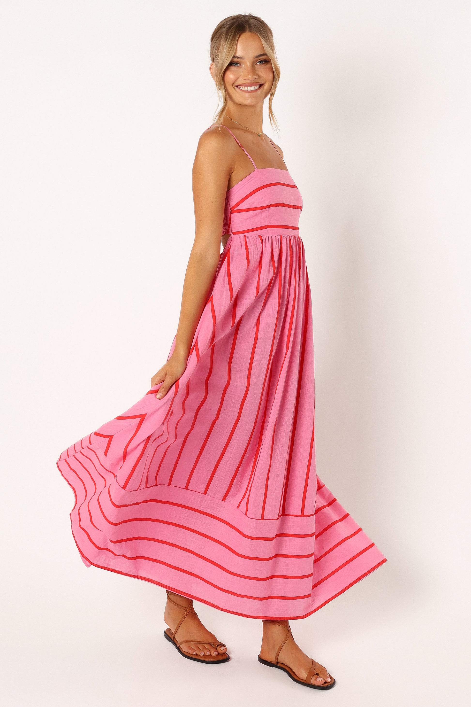 Pink striped maxi dress styled on model — casual look with sandals