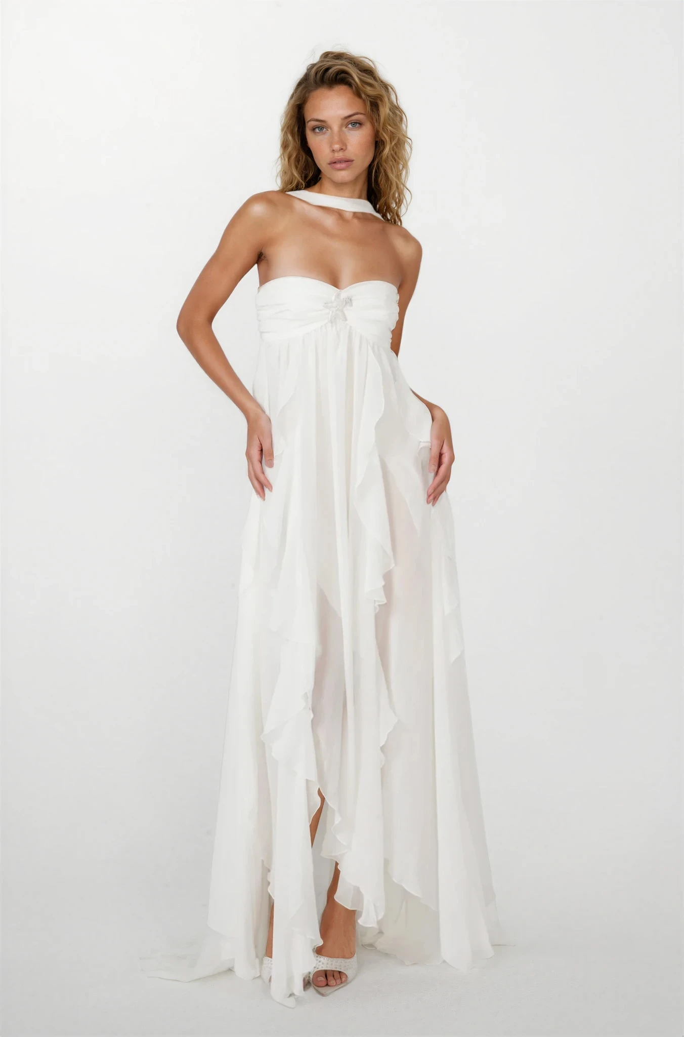 Front view of a white ruched maxi dress with a strapless design, halter tie, and flowing ruffled skirt.