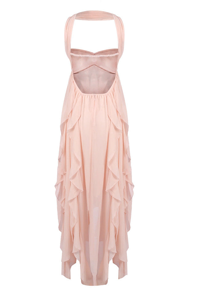 Back view of Elaina peach ruched maxi dress, featuring open back design and cascading ruffles