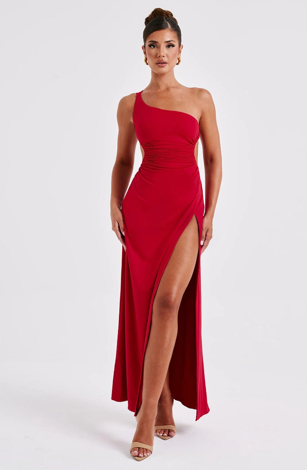 Red Elara Ruched Maxi Dress with one-shoulder design, side cut-out, and high slit, front view.