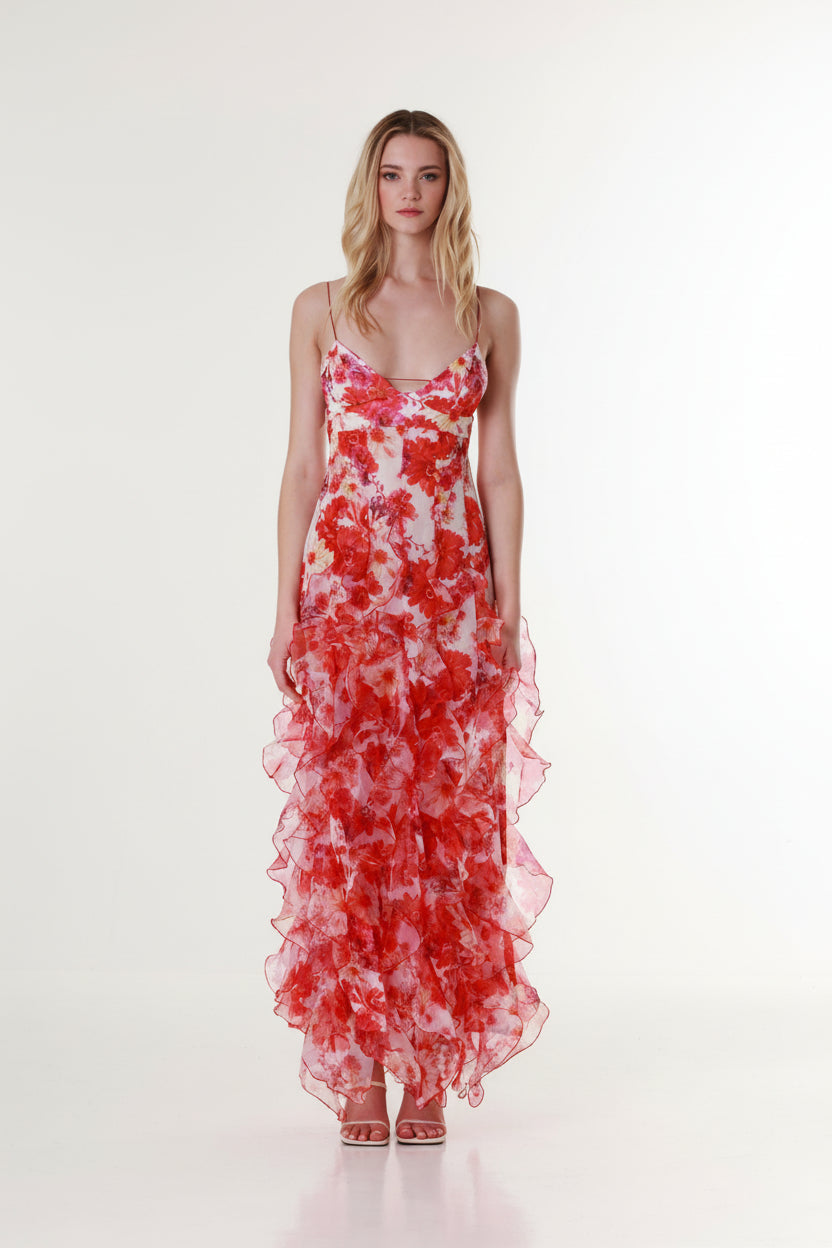 Full front view of a red and pink floral maxi dress with ruffle skirt and delicate straps