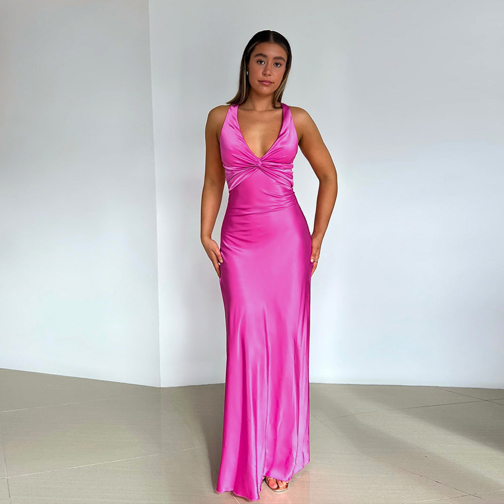Full-length yellow satin maxi dress with a twisted knot bodice and V-neckline, perfect for a wedding.