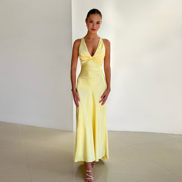 Full-length yellow satin maxi dress with a twisted knot bodice and V-neckline, perfect for a wedding.
