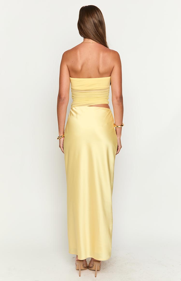 Back view of the yellow Elinor cutout maxi dress, showcasing the full length and elegant drape.