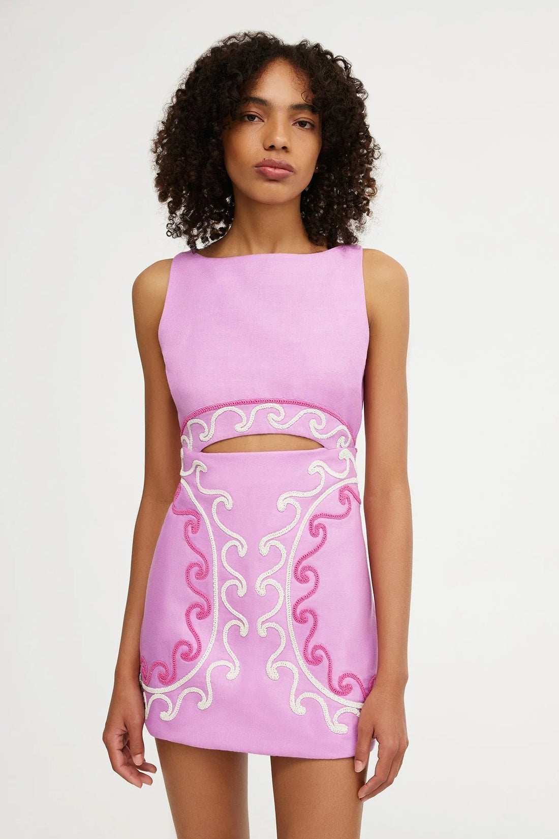 Pink embroidered mini dress with waist cutout detail and square neck for women, front view.