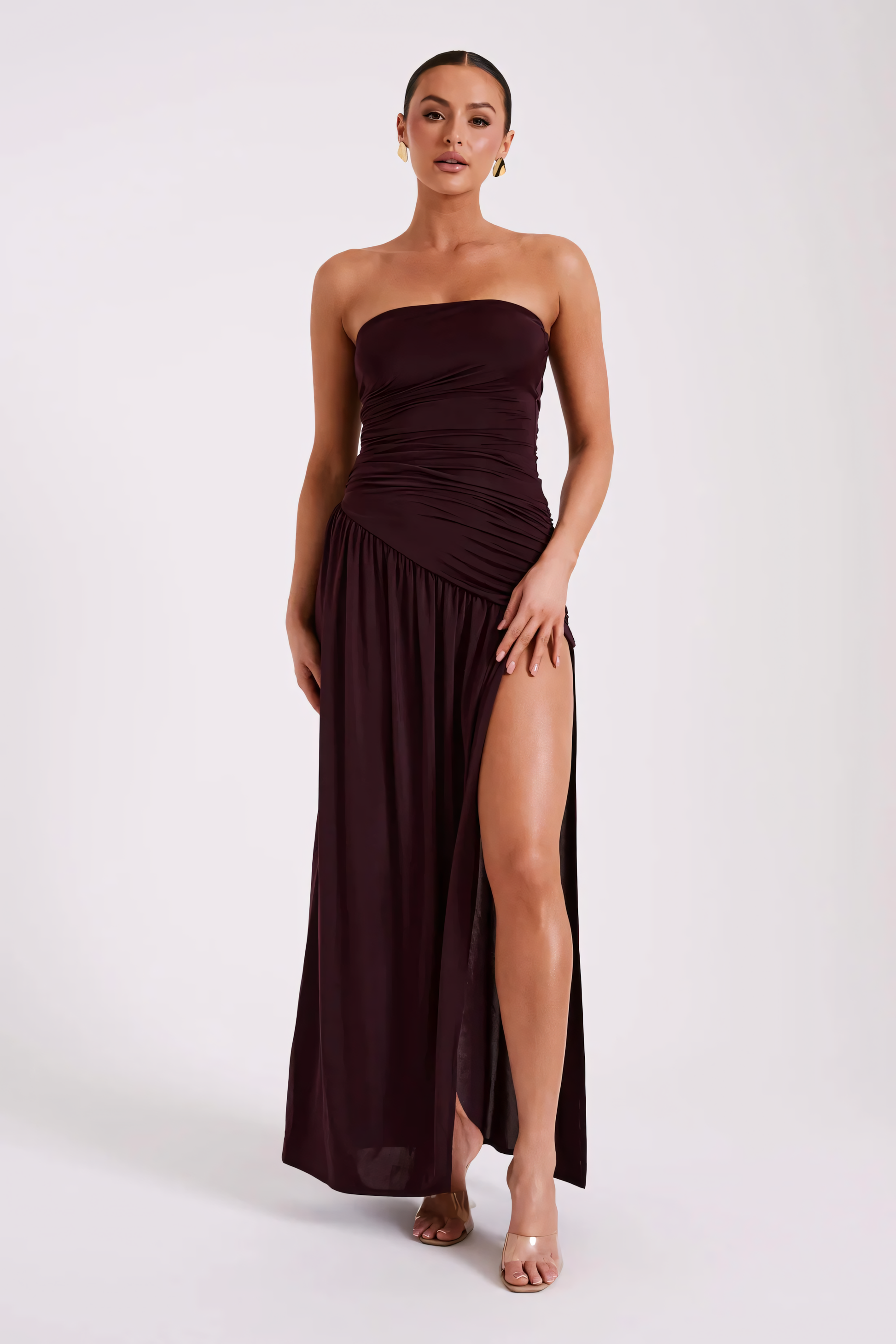 Burgundy strapless ruched maxi dress with a high side slit for women, front view