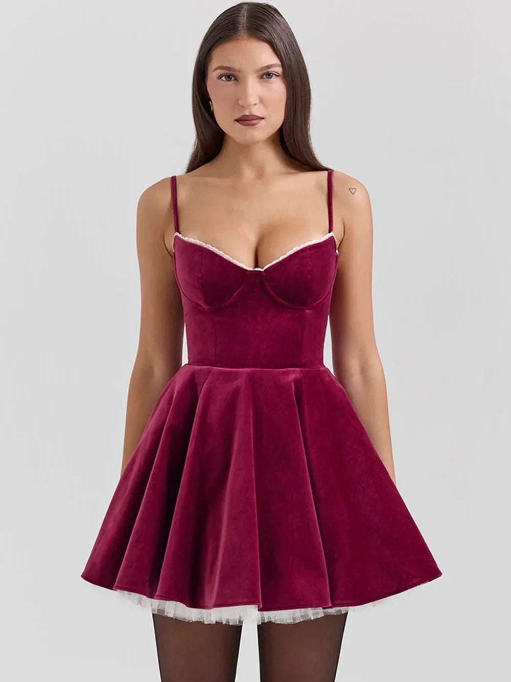 Front view of an elegant deep red velvet mini dress with a fitted bodice, sweetheart neckline, and voluminous skirt with white tulle underlayer.