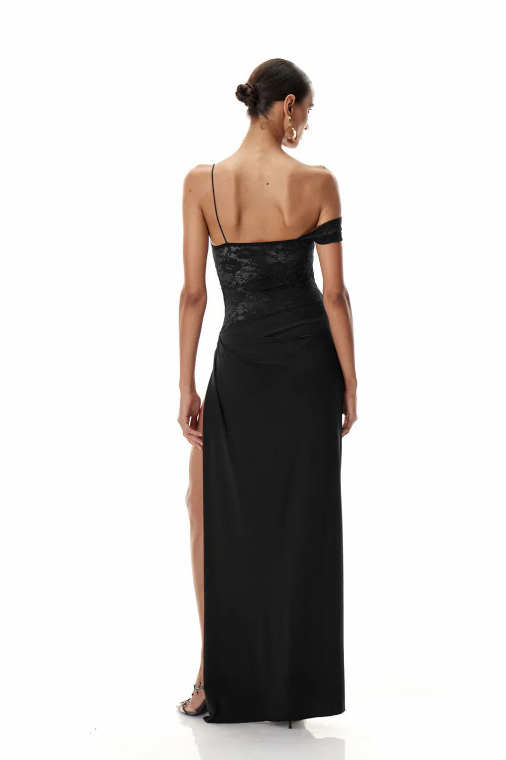 Rear view of the black Emmalyn Lace Maxi Dress, showing the back of the lace bodice and the long, flowing skirt.