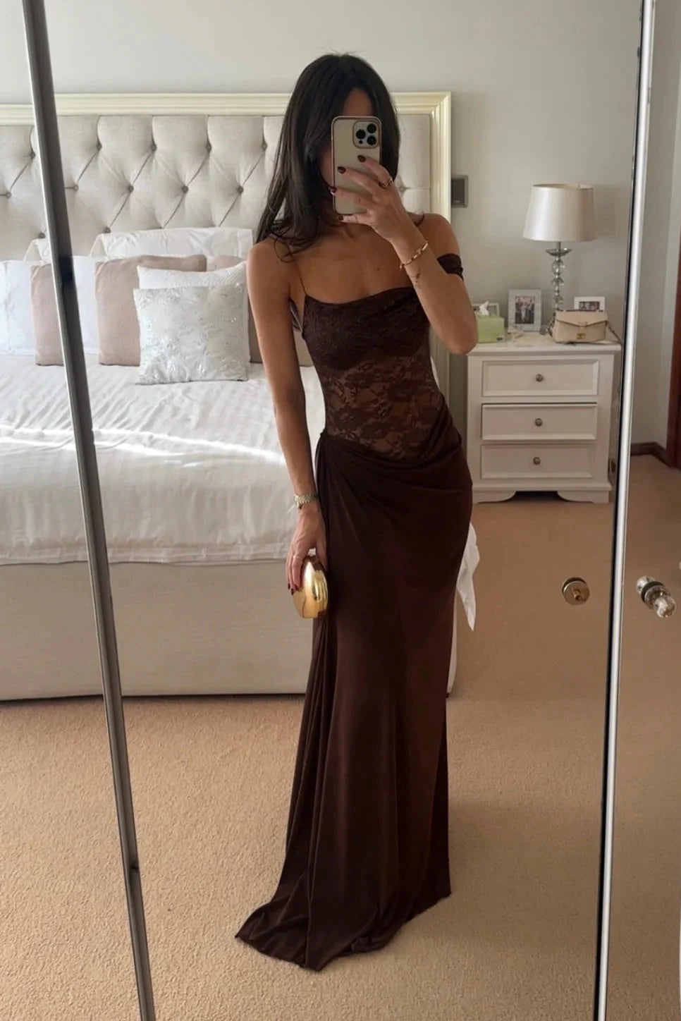 Full-length mirror shot of Emmalyn Lace Maxi Dress in brown, featuring a lace bodice and flowing skirt with a side slit.