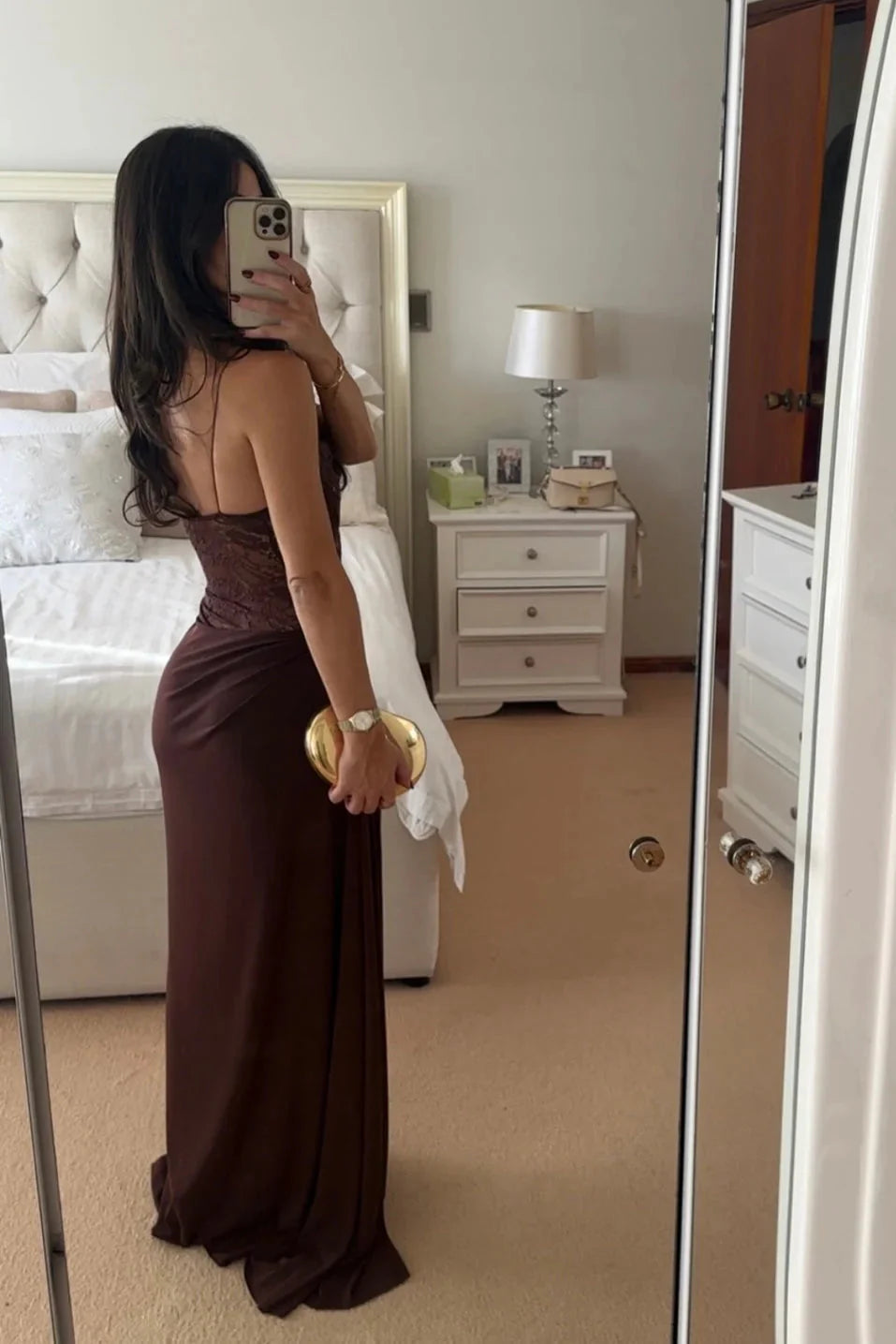 Side profile of the Emmalyn Lace Maxi Dress in brown, highlighting the draped skirt and the intricate lace bodice design.
