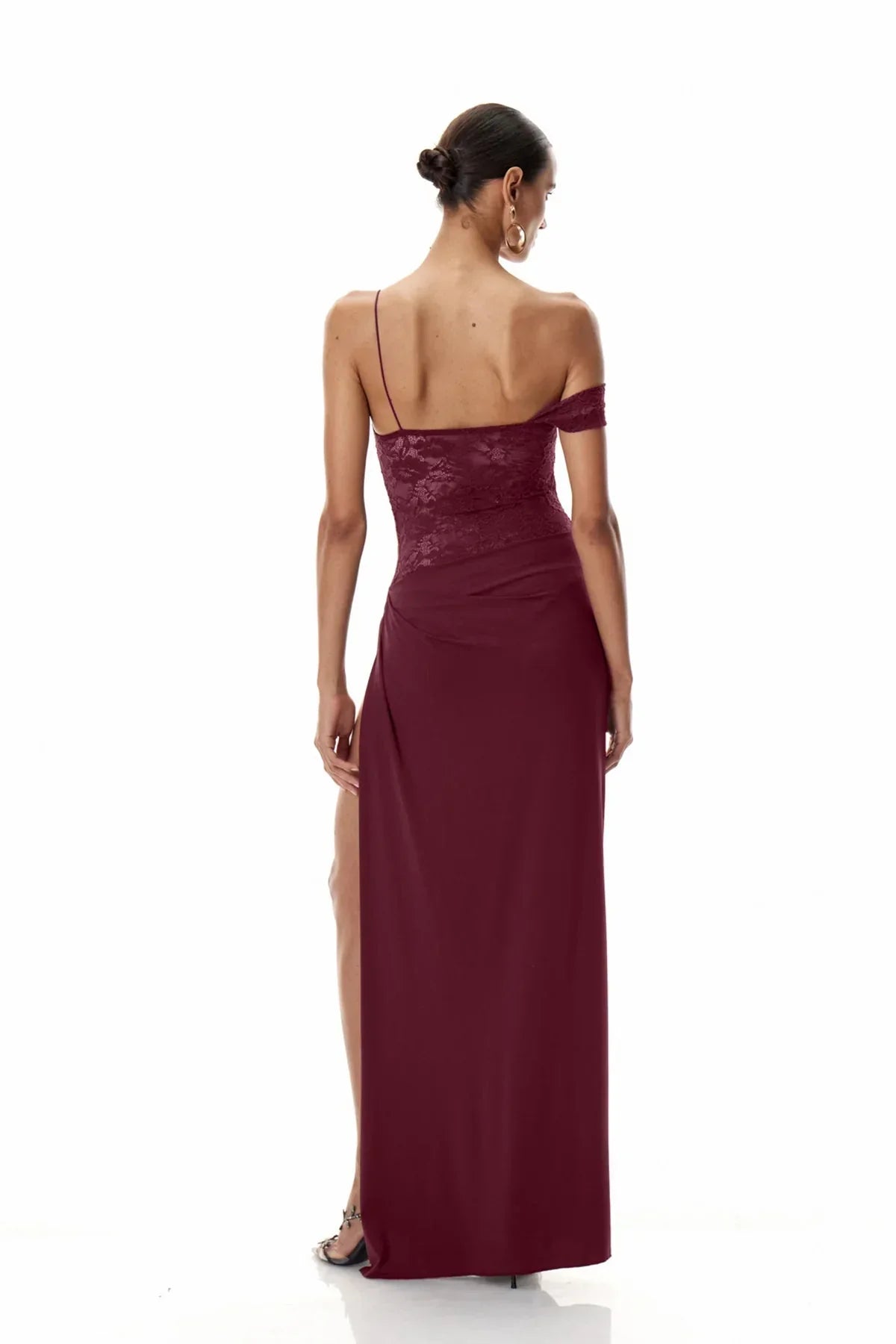Back view of the burgundy Emmalyn Lace Maxi Dress, showcasing the single spaghetti strap and the lace back detail.