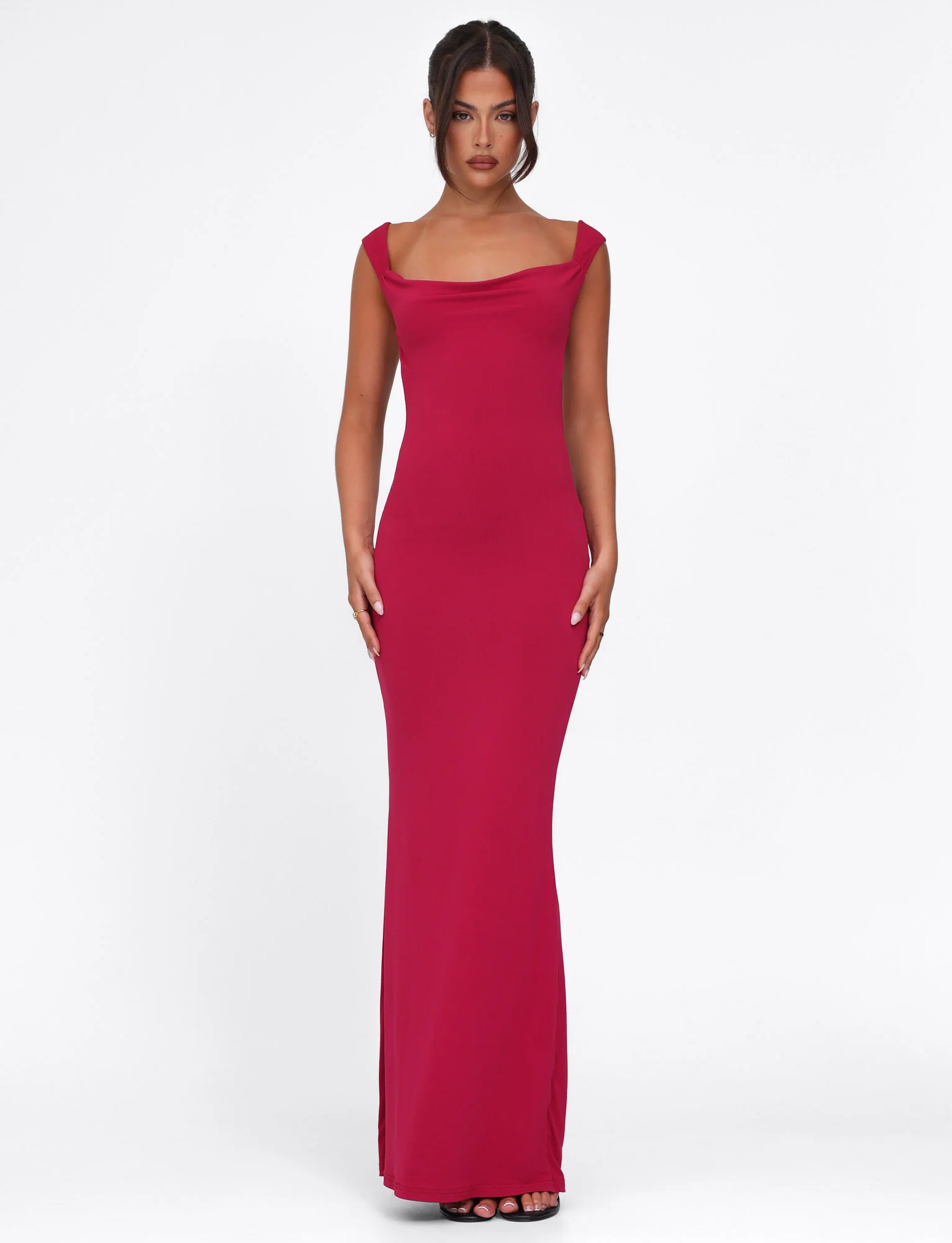 Full-length view of a deep red maxi dress with a cowl neck and off-shoulder straps, featuring a fitted silhouette.