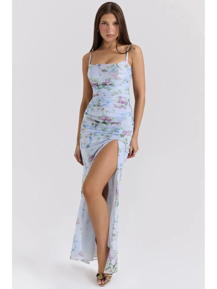 Full length view of a light blue floral maxi dress featuring a sweet heart neckline and a daring side slit.